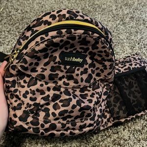 Tushbaby. Nearly brand new. Used maybe 2 times. No stains or holes